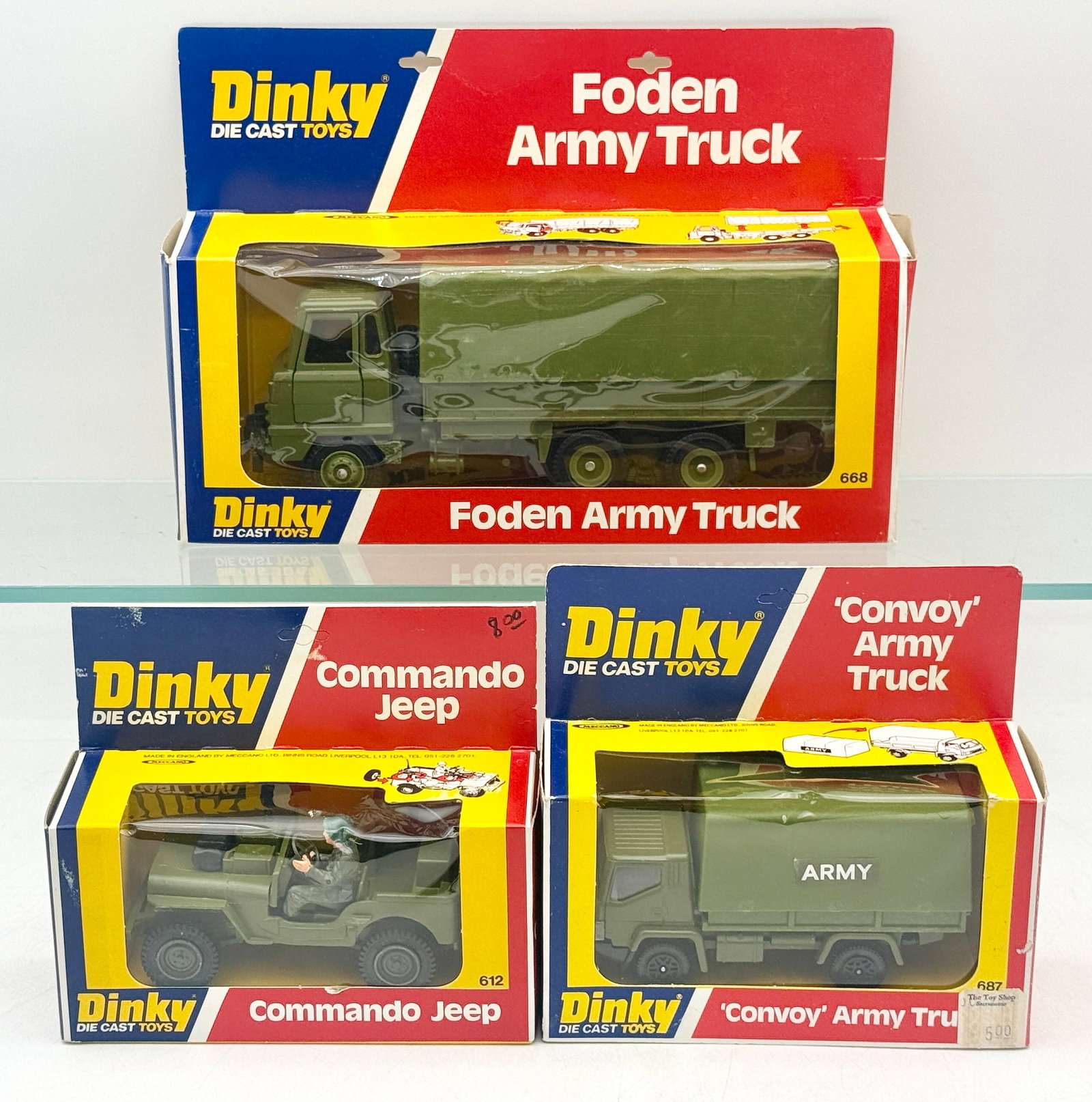 A Trio of Dinky Die-Cast Military Vehicles in Original Packaging: A trio of Dinky die-cast military vehicles manufactured by Meccano Ltd. in England during the late 1970s. The group features an olive drab finish and includes model No. 668 Foden Army Truck, No. 612 C