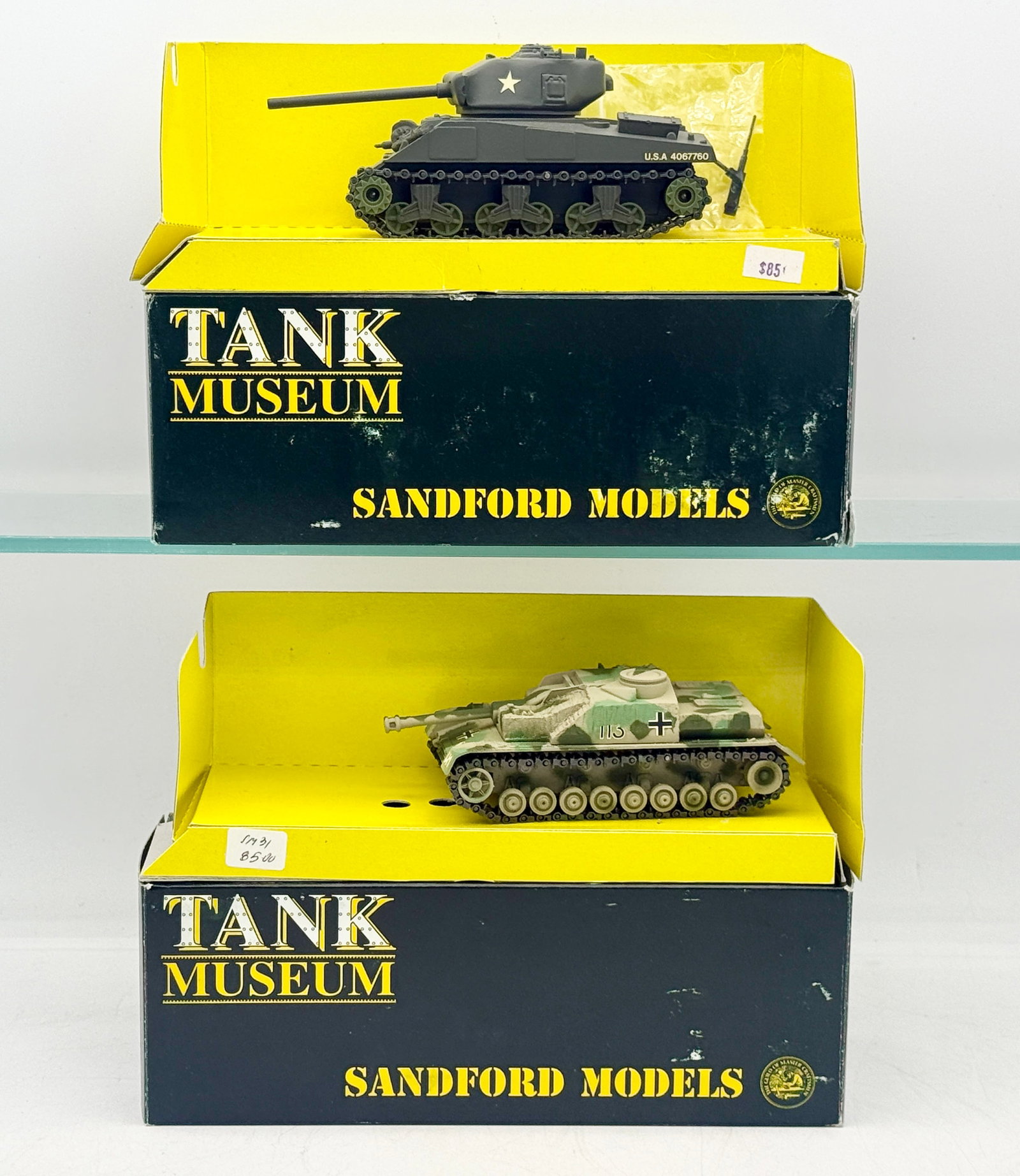 A Pair of Sandford Models Tank Museum Die-Cast Tanks: A pair of die-cast military model tanks produced by Sandford Models for the Tank Museum collection, manufactured in England. The set includes an American M4 Sherman finished in olive drab (SM40) and a
