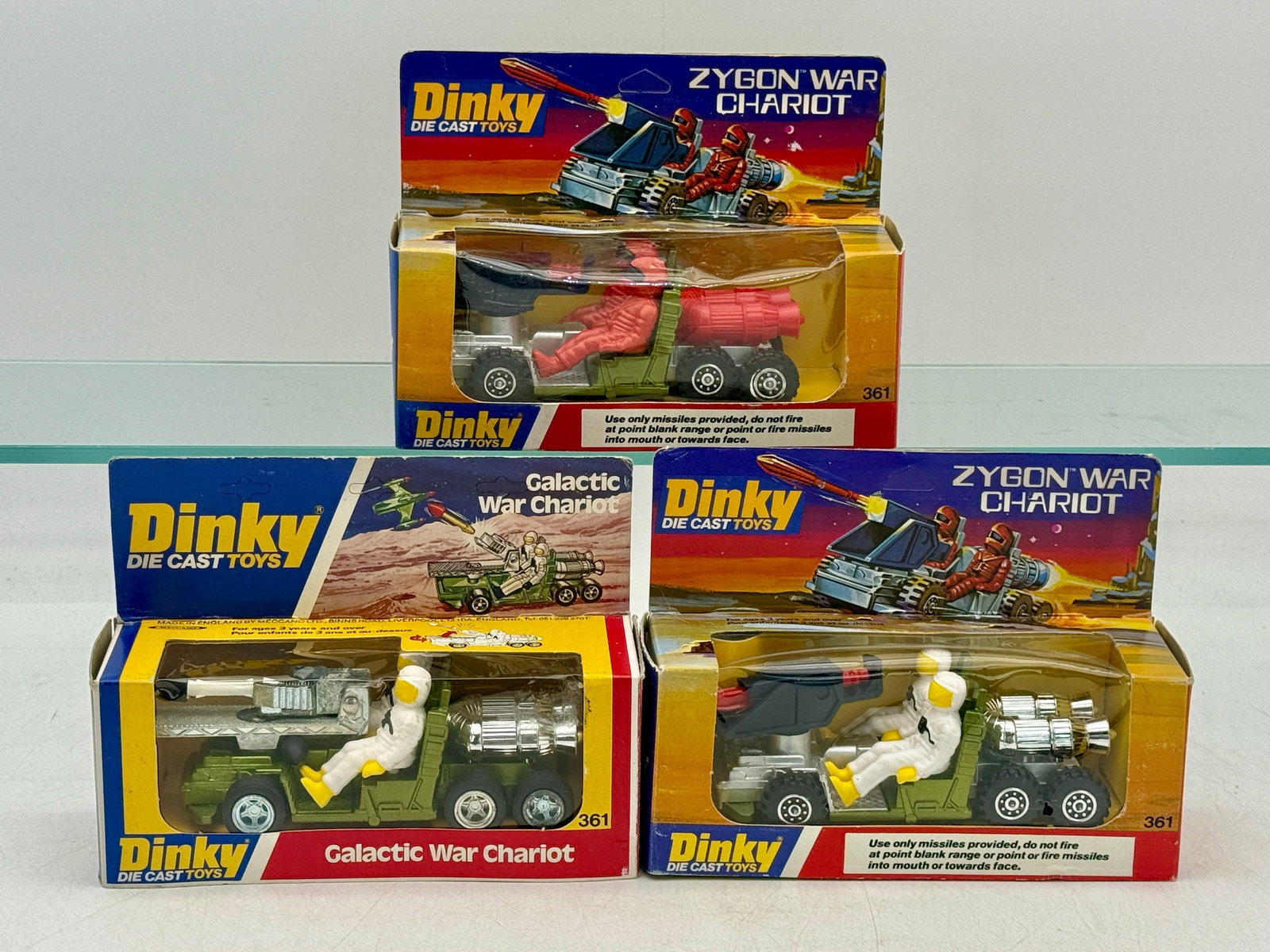 A Trio of Dinky 361 Galactic and Zygon War Chariots: Dinky 361 die-cast vehicles manufactured by Meccano Ltd. in Liverpool, England. A collection of Zygon and Galactic War Chariots featuring plastic crew figures and functional spring-loaded missile laun