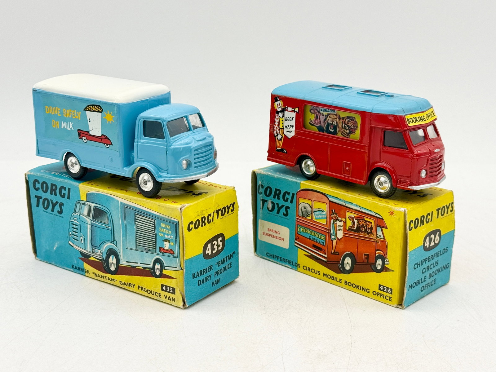 Two Boxed Corgi Toys Die-Cast Commercial Vehicles, Models 435 and 426: This pair features a Corgi Toys number 435 Karrier Bantam Dairy Produce Van and a number 426 Chipperfields Circus Mobile Booking Office. These die-cast metal vehicles include original paint and graphi