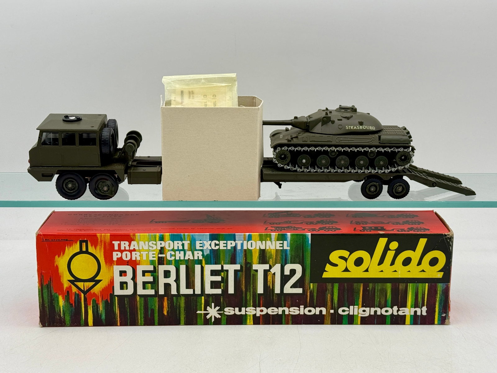 Solido No. 211 Bis Berliet T12 Military Transporter with Tank: This Solido military set features a die-cast Berliet T12 transporter with a lowboy trailer and an accompanying tank marked Strasbourg on the turret. Both vehicles are finished in olive-drab green and 