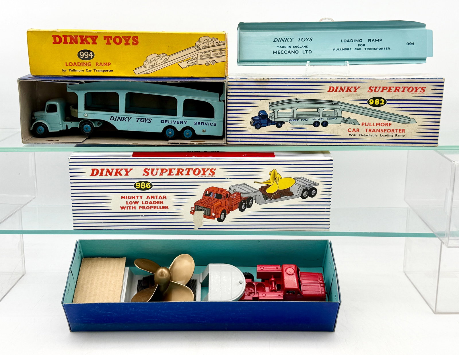 A Trio of Dinky Supertoys Boxed Die-Cast Commercial Vehicles: A trio of vintage Dinky Supertoys die-cast commercial vehicles manufactured in England by Meccano Ltd. The lot includes a #982 Pullmore Car Transporter, a #994 detachable loading ramp, and a #986 Migh