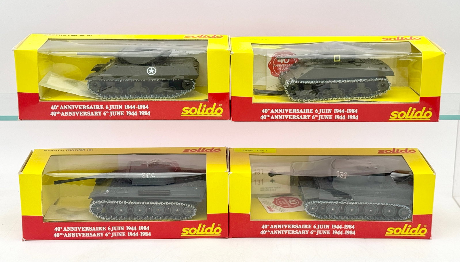 A Group of Solido 40th Anniversary D-Day Die-Cast Military Vehicles: This group of Solido die-cast military vehicles was released in 1984 to commemorate the 40th anniversary of the D-Day landings. The collection includes a Destroyer M10, Sherman M4 A3, PzKpfw Panther (