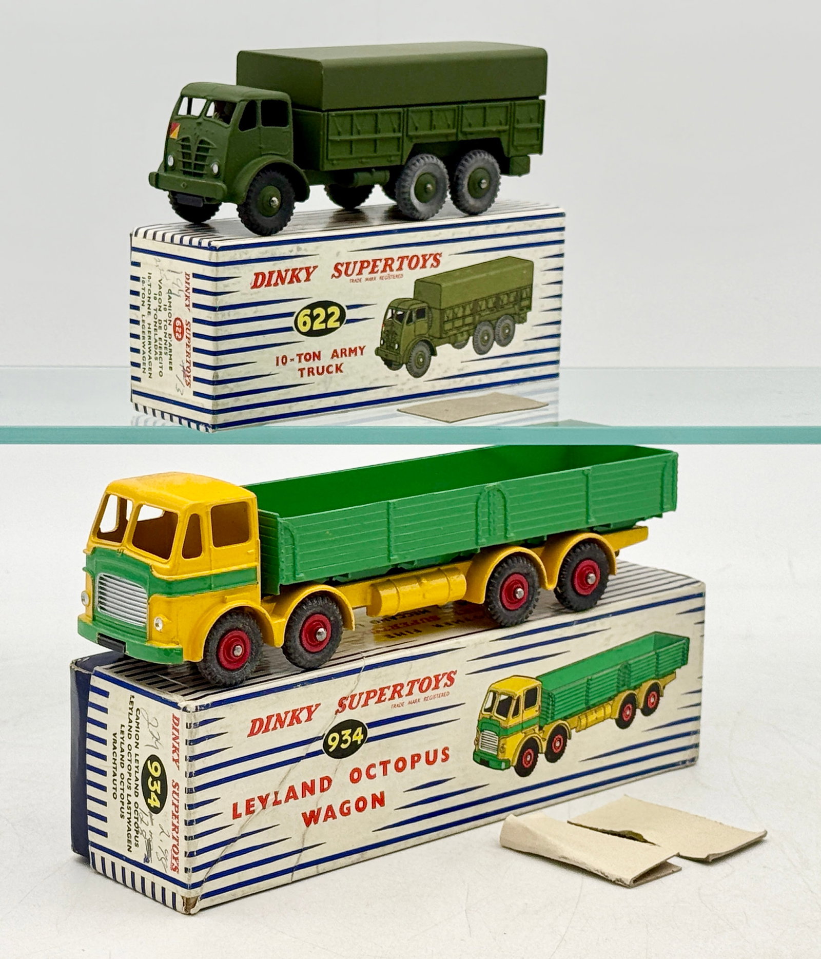 Two Dinky Supertoys No. 622 and No. 934 Die-Cast Trucks: These Meccano Ltd. Dinky Supertoys consist of a No. 622 10-Ton Army Truck and a No. 934 Leyland Octopus Wagon. Both vehicles are constructed of die-cast metal and are accompanied by their original blu