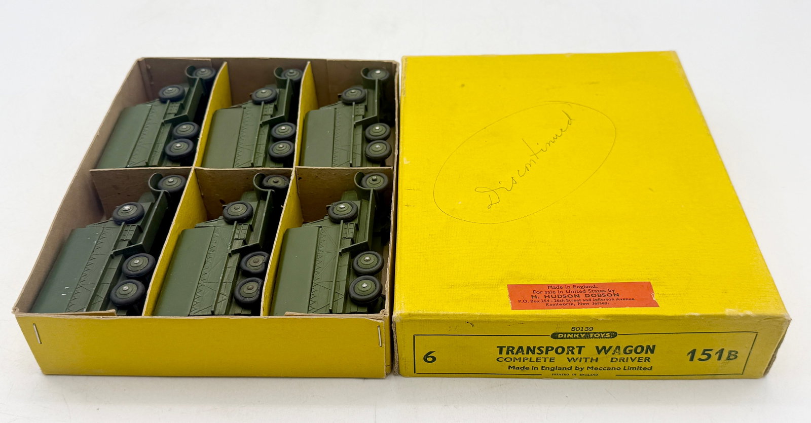 A Set of Dinky Toys 151B Military Transport Wagons: A set of Dinky Toys No. 151B Transport Wagons manufactured in England by Meccano Limited. Each die-cast vehicle features an olive drab finish, a six-wheel chassis, and a seated driver figure under a c