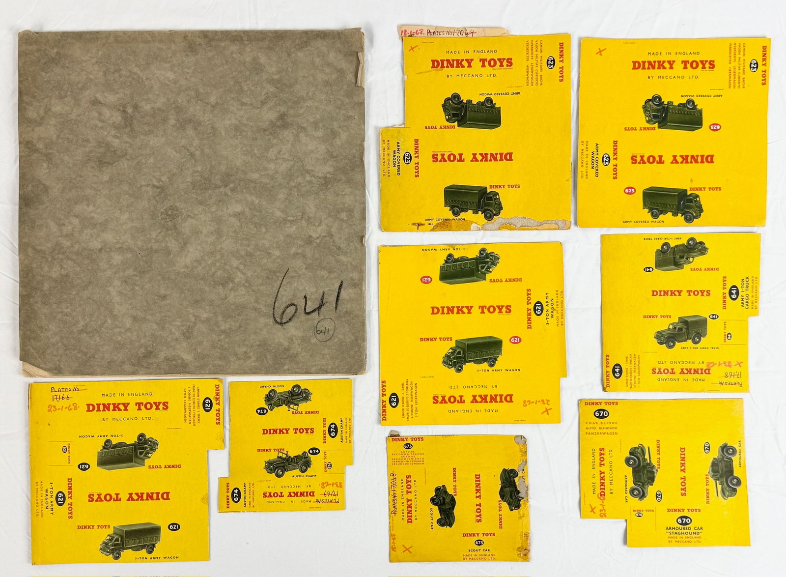 A Collection of Dinky Toys Military Vehicle Packaging Proofs and Flats: A collection of Meccano Ltd. Dinky Toys production artwork and printed box flats featuring various military vehicle models. The group includes paper layout proofs for the No. 641 Army Cargo Truck with