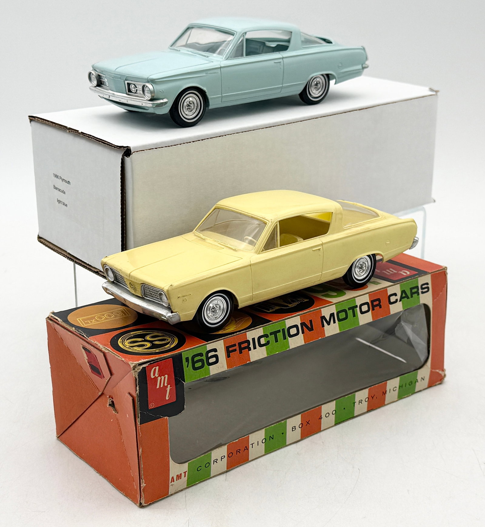 2 AMT Plymouth Barracuda Friction Motor Cars: AMT manufactured this pair of 1/25 scale plastic friction-motor models representing the 1966 Plymouth Barracuda fastback with OB (coaster). 1964 Blue Barracuda Friction working. The vehicles are finis