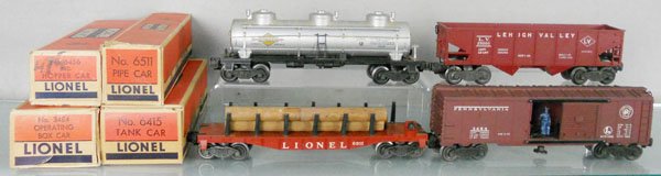 4 LIONEL FREIGHT CARS: O ga, 6415 Sunoco tank, oxidation on railing, 6456 LV hopper, 6511 lumber car, 3484 PRR box car, orig boxes minor wear, C7-8.
