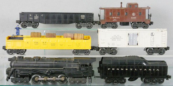 LIONEL TRAIN SET: O ga, 671 turbine loco, 2671WX tender, 3562-50 barrel car, 3462 milk car, steps chipped, 6462 gondola, 6457 caboose, C5-6.