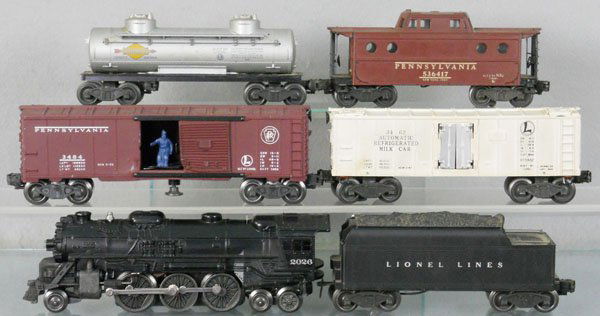 LIONEL TRAIN SET: O ga, 2026 loco, restored, 6466W tender, repro shell, 3484 operating box car, 2 melted sections, 3462 milk car, 6465 tank car, 6417 NY Zone caboose, C5-7.