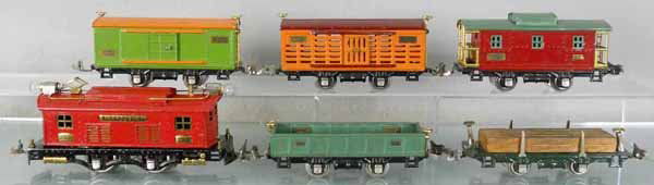 LIONEL TRAIN SET: O ga, 253 loco, restored in red, 902 gondola, 831 lumber, 805 box car, 806 stock car, 807 caboose, C5-6.