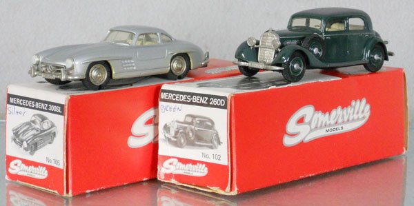 2 SOMERVILLE MERCEDES AUTOS: white metal, 105 Mercedes Benz 300SL, rubber tires cracking, 1 tire missing, 102 Mercedes Benz 260D, orig boxes & inserts minor wear, C8-9.