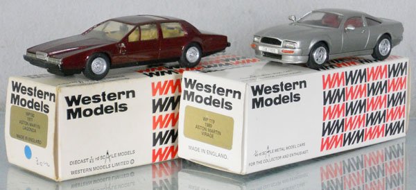 2 WESTERN MODELS ASTON MARTINS: white metal, 1977 Aston Martin Lagonda, 1 side mirror missing, other loosely hanging, windows are foggy, 1989 Aston Martin Virage, windows are foggy, orig boxes & inserts, 1 worn, C7-8.