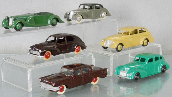 6 DINKY VEHICLES: 179 Studebaker President, chip on front bumper, 39E Chrysler, large chip on rear, 24R Peugeot 203, 39B Oldsmobile, touch up spot, 38C Lagonda, 40A Riley, all are repainted, C8.