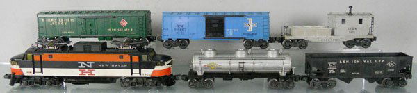 LIONEL TRAIN SET: O ga, 2350 New Haven EP5, frame repainted over some old battery damaged, end decals worn, 6415 tank, 1 catwalk chipped, 6476 hopper, 6572 REA reefer, 6464-475 B&M box car, 2419 work caboose, C4-5.