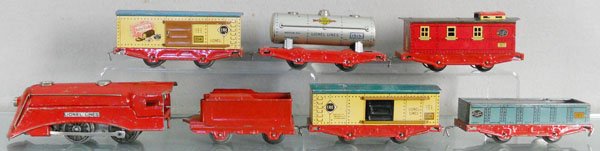 LIONEL TRAIN SET: O ga, 1511 loco, windup working, 1516 tender, 1514 box car, 1512 gondola, 1514 box car, 1515 tank car, 1517 caboose, C5-6.