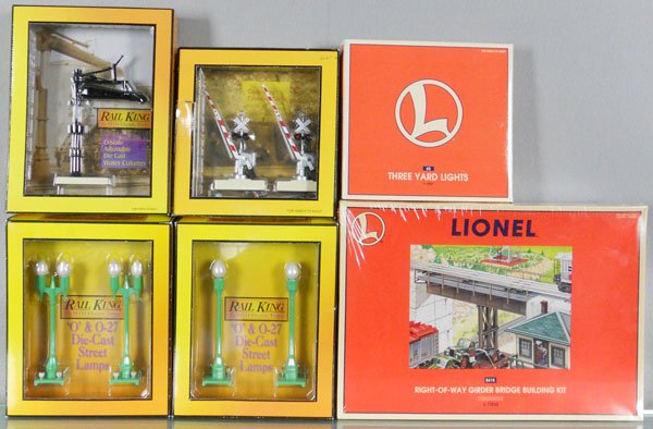 9 MTH & LIONEL ACCESSORIES: O ga, MTH 1070 lamps, 11012 crossing gates, 1071 lamps, 11007 water column, Lionel 2 #12927 yard lights, 3 #12968 girder bridge kits, not all shown in photo, orig boxes, C9-10.