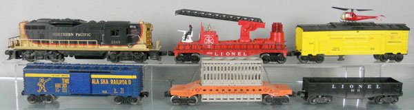 LIONEL TRAIN SET: O ga, 2349 NP diesel loco, frame repainted, 3512 fire ladder car, ladder holder missing 1 tip, missing 1 nozzle, 3619 helicopter reconnaissance car, helicopter has broken tail, 6464-825 Alaska box car