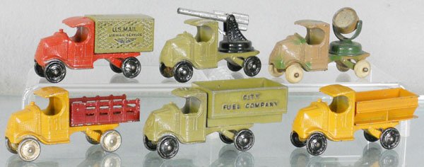 6 TOOTSIETOY MACK TRUCKS: 4645 US Mail, 4643 AA Gun, 4644 Searchlight, 4638 Stake, 46XX City Fuel Co, 4639 Coal, C5-6.