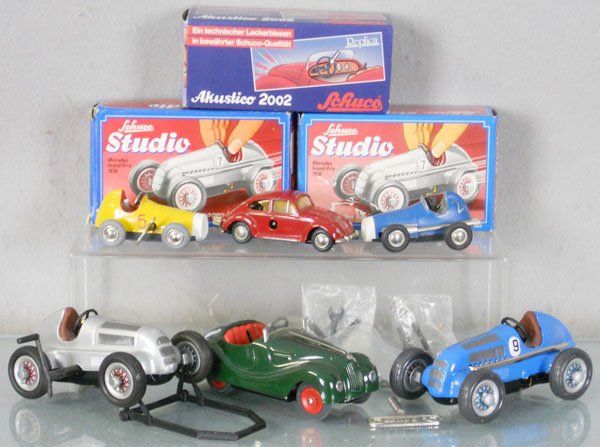 5 SCHUCO AUTOS: 2 #1050 Studio, 2002 Akustico, 2 #1042 Micro Racers, all are windups working, w/some accessories, all are contemporary reissues, 3 orig boxes only, C7-10.