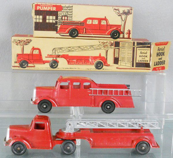2 TOOTSIETOY FIRE ENGINES: 489 Aerial Hook & Ladder, 8 3/4" long, 469 Pumper, 6 1/4" long, painted die cast, orig boxes worn, C7-8.