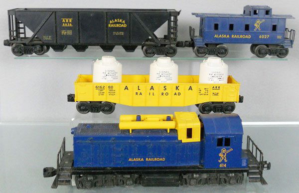 LIONEL ALASKA TRAIN LOT: O ga, 614 diesel loco, hairline screw crack, 6162-60 gondola w/canisters, 6636 hopper, 6027 caboose, C5-6.