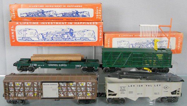 4 LIONEL FREIGHT CARS: O ga, 3364 log car, 3376 giraffe car, 3434 poultry dispatch, 6476 LV hopper, 3 orig boxes only, boxes worn, C7-8.