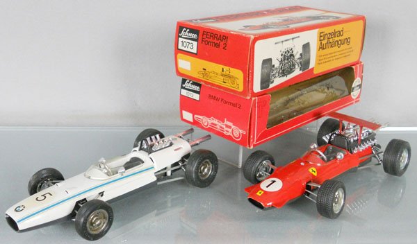 2 SCHUCO FORMULA 1 RACERS: 1072 BMW, 1073 Ferrari, w/keys & wrenches, windups working, orig boxes minor wear, C8.