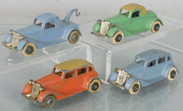 4 TOOTSIETOY '35 FORDS: 113 Wrecker, 114 Convertible Coupe, 115 Convertible Sedan, 111 Sedan, C5.