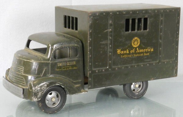 SMITH MILLER BANK OF AMERICA TRUCK: die cast car w/pressed steel box trailer, doors intact, front bumper broken on 1 side, 13 1/2" long, C5.