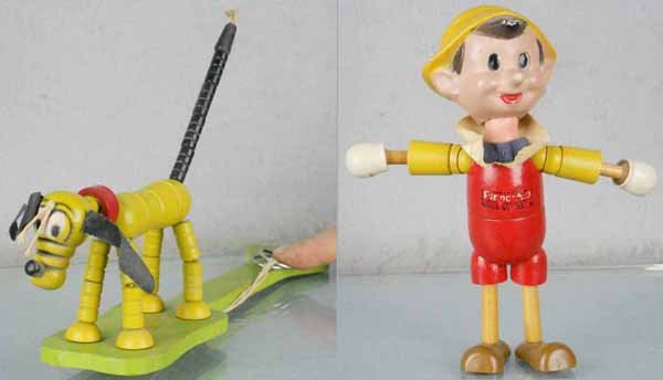 2 DISNEY TOYS: Fisher Price Pop-Up Pluto, painted wood, base is 10 1/2" long, rubberstamp intact, Ideal Pinocchio, painted wood, 7 1/2" tall, some cracking on face, label worn, C7.