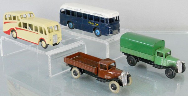 4 DINKY VEHICLES: 280 Observation Coach, 283 BOAC Bus, 25C Tipper, 25B Covered Wagon, both trucks have repainted grilles, C6-7.
