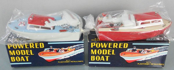 2 UNION CRAFT MOTOR BOATS: plastic, both 8" long, battery operated, not tested, sealed in orig bags, orig boxes, C9.