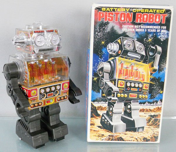 SH PISTON ROBOT: plastic, battery operated, not working, 10 1/2" tall, orig box & insert minor wear, C8-9.