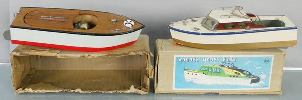 2 WOODEN MOTOR BOATS: wood, both 10" long, battery operated, not tested, Cabin Cruiser missing propeller, upper windshield bent, other boat missing battery contact, orig boxes, 1 minor wear, other rough, C7.