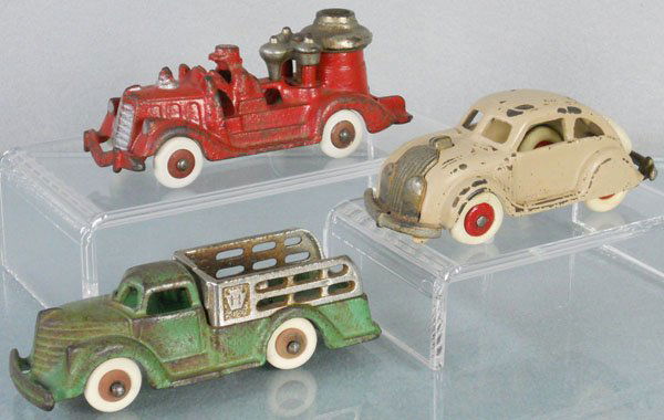 3 HUBLEY VEHICLES: painted cast iron, Fire Engine, 5" long, Stake Truck, 5" long, Airflow, 4 1/2" long, C4-5.