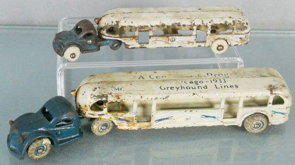 2 ARCADE GREYHOUND BUSES: painted cast iron, Century of Progress, Chicago 1933, the 7 1/2" long has paint worn on roof, missing 2 tires, the 10" long has oxidation spots & worn lettering, C3-4.