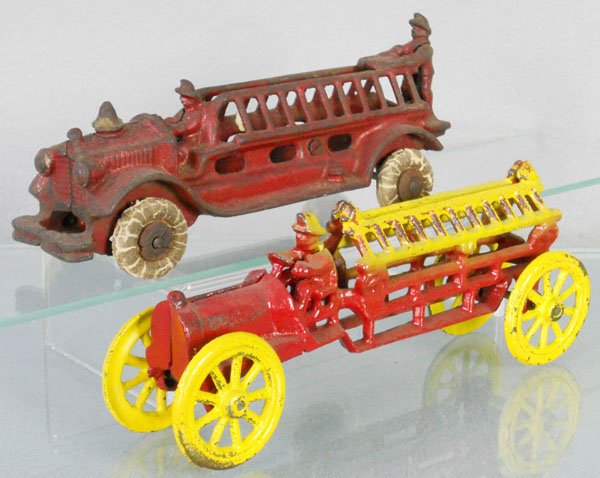 2 HUBLEY FIRE ENGINES: painted cast iron, Ladder Truck, 7 1/2" long, tires worn, Ladder Truck, 8" long, repainted, C3-5.