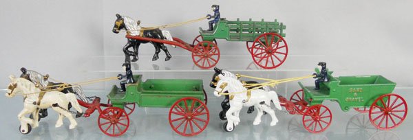 3 KENTON WAGONS: painted cast iron, 14 1/2" long, Stake Wagon, horse missing rubber tire, Delivery Wagon, Sand & Gravel, C7-8.