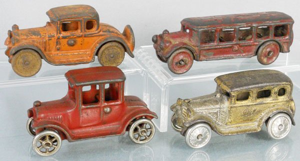 4 AC WILLIAMS & HUBLEY TOY AUTOS: painted cast iron, AC Williams Coupe, 4" long, Bus 5" long, Sedan, 4" long, Hubley Model T, 4" long, C1-3.