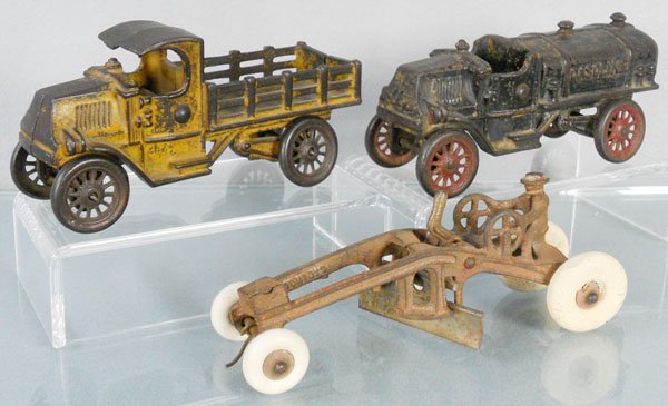 3 TOY VEHICLES: painted cast iron, AC Williams Mack Stake Truck, 7" long, Gasoline Truck, 7" long, broken roof & rear spigot, Kenton Grader, 7 1/2" long, C1-3.