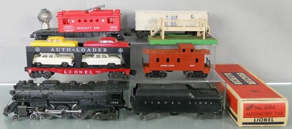 LIONEL TRAIN SET: O ga, 2046 loco, 2046W tender, 6414 auto loader, orig box worn, 3535 security car, 3462 milk car & platform, platform has oxidation, 6017 caboose, C4-5.