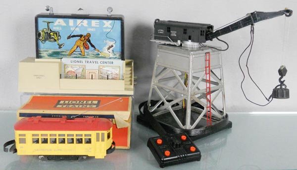 3 LIONEL ACCESSORIES: O ga, 334 dispatch board, 60 trolley, w/rough orig box, 182 crane, base repainted & flaking, small melt in cab, C5.