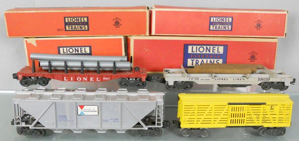 4 LIONEL FREIGHT CARS: O ga, 6511 pipe car, 3361X lumber car, 6346 Alcoa car, 6656 stock, orig boxes minor wear, 1 taped, C7-8.