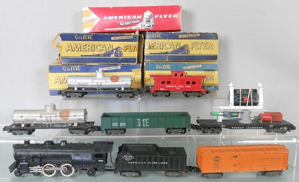 AMERICAN FLYER TRAIN SET: S ga, 303 loco & tender, 1 step broken, 2 #925 Gulf tanks, 931 gondola, 923 box car, 24044 rocket launcher, rocket broken & incom, 938 caboose, orig boxes rough, C6-7.