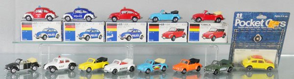 14 TOMICA/TOMY VOLKSWAGENS: 8 Tomica F20 Volkswagen Beetle Convertibles, all different, 4 F20 Emergency Vehicles, all different, w/3 orig boxes marked F70 & 2 boxes marked F23, boxes have some wear, Tomy 195-F20 Super Bug, seale