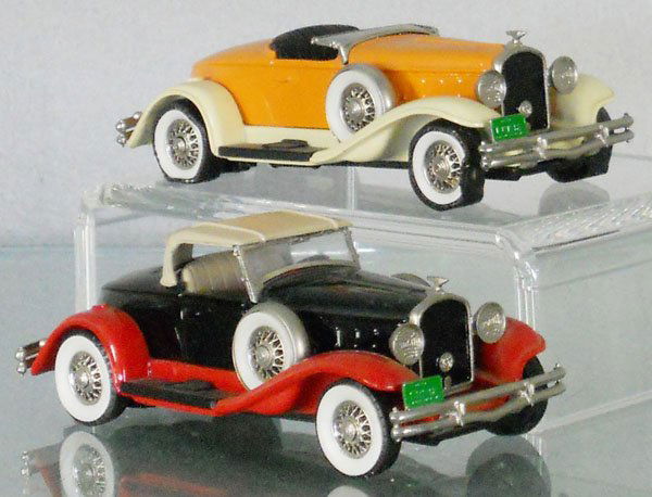 2 BROOKLIN MODELS: 2 #12 1931 Hudson Greater 8, white metal, boat tail bodies, the orange one has melted tires, windshield taped to bottom of car, C8.