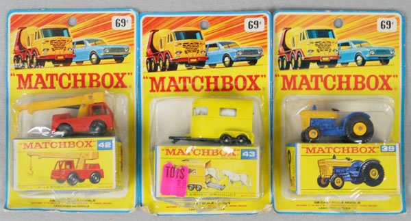 3 MATCHBOX CARDED VEHICLES: 42C1 Iron Fairy Crane, 43C2 Pony Trailer, 39C1 Ford Tractor, factory sealed on orig cards, cards have some wear, C10.