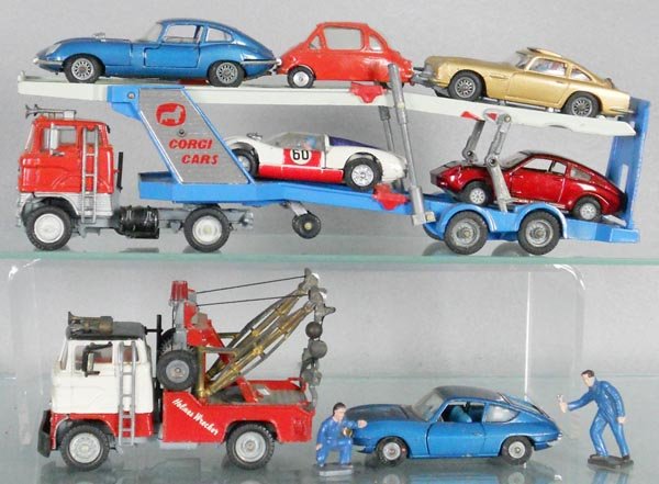 CORGI VEHICLE LOT: 1138 Ford Auto Transport, some paint embellishment on cab, 1142 Holmes Wrecker, missing front bumper stickers, 335 Jaguar, 233 Heinkel, 261 Aston Martin, 330 Porsche, 341 Mini Marcos, C5-7.