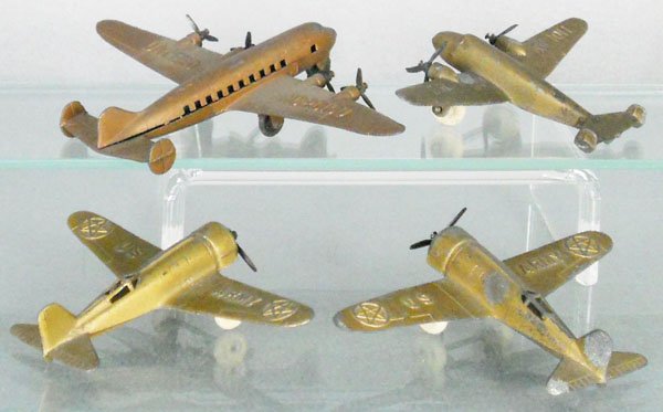 4 GOLD TOOTSIETOY AIRPLANES: 722 Douglas Dc-4, 125 Lockheed Electra, 2 #119 US Army, 1 has a broken propeller, C5-6.